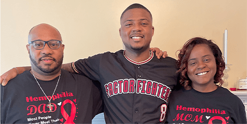 Austin with his parents Austin with his arms around his parents